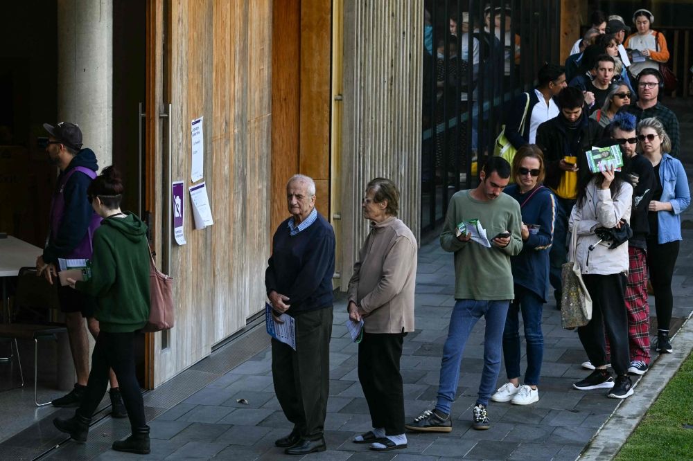 People queue to vote in Australia's general election at a polling station in the suburb of Marrickville in Sydney May 3, 2025. — AFP pic
