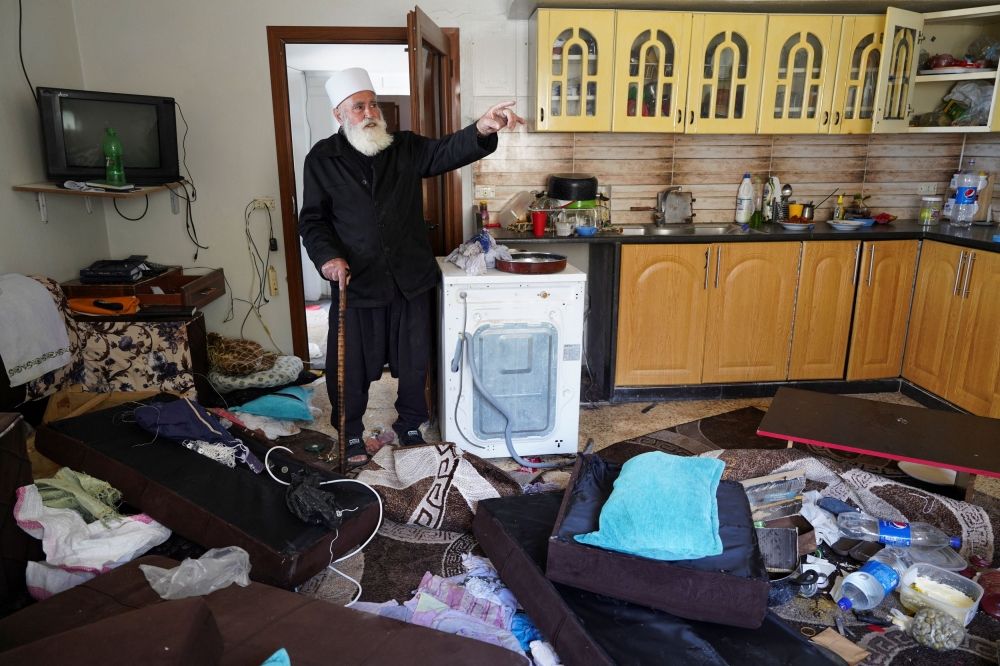 A Druze resident of Al-Soura al-Kubra, Salman Olaiwi, inspects his damaged home, following clashes between Sunni Islamist militants and Druze fighters, in Sweida province, Syria, May 2, 2025. — Reuters pic