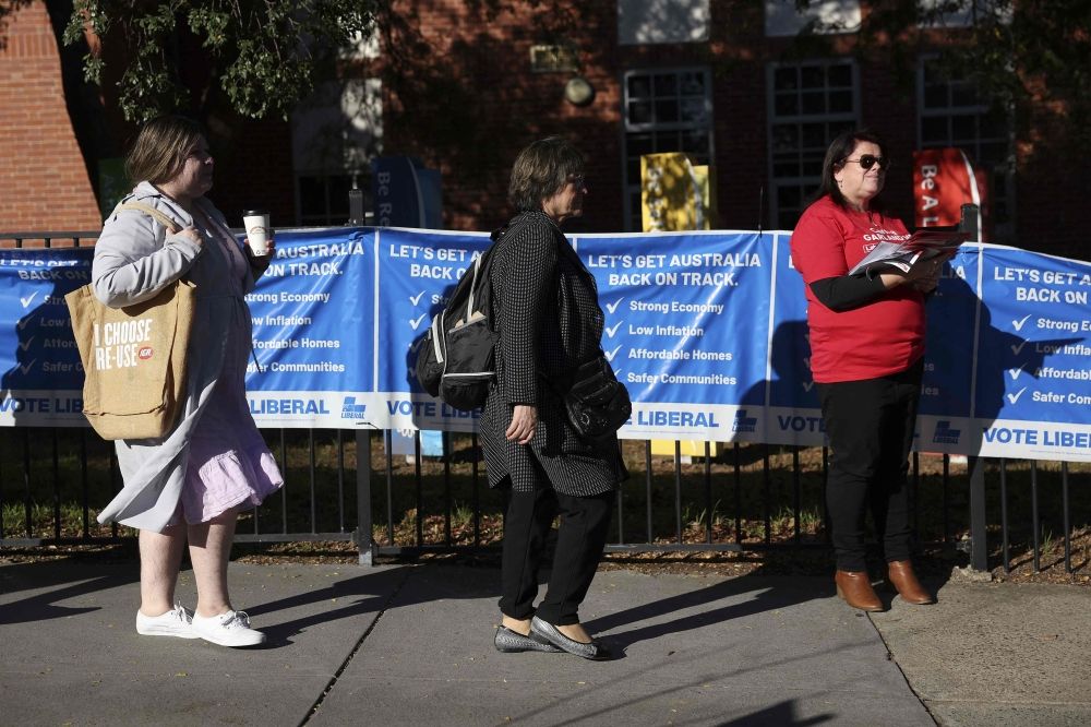 Voters wait to cast their ballots in Australia? general election at a polling station in Melbourne May 3, 2025. — AFP pic
