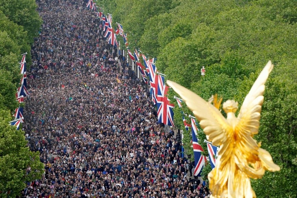 ‘Courage of an entire generation’: Crowds flood London to honour 80th anniversary of WWII victory People walk up The Mall towards Buckingham Palace ahead of a Red Arrows flypast following a military procession celebrating the 80th anniversary of VE Day also known as Victory in Europe Day, marking the end of the Second World War in Europe, in central London yesterday. — AFP pic
