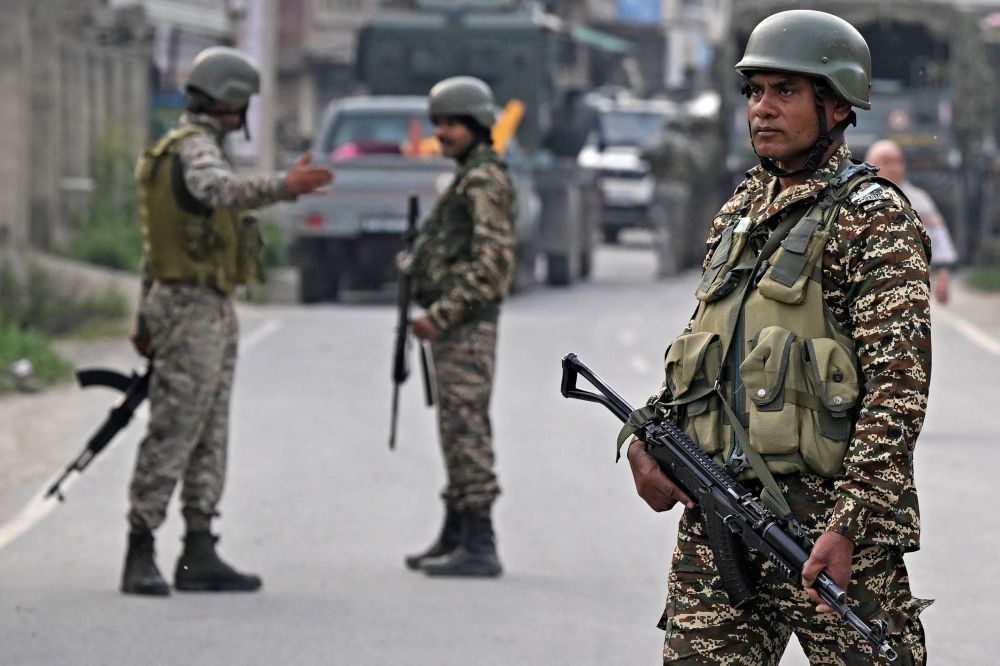 Indian security personnel stand guard in Wuyan near Srinagar on May 7, 2025, following border tensions. — AFP pic