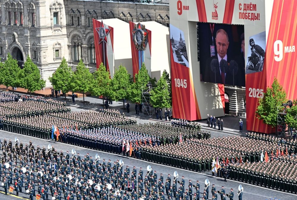 Russian President Vladimir Putin is seen on a screen while delivering a speech during a military parade on Victory Day, marking the 80th anniversary of the victory over Nazi Germany in World War Two, in Red Square in central Moscow, Russia, May 9, 2025. — Maxim Bogodvid/Host agency RIA Novosti handout pic via Reuters