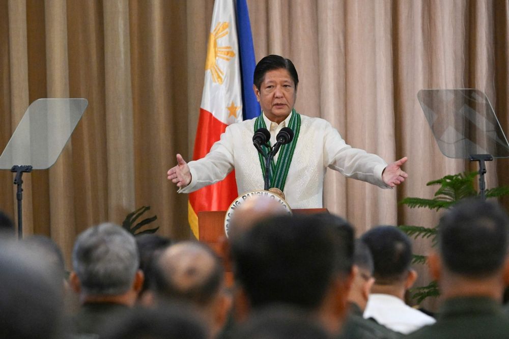 Philippines' President Ferdinand Marcos Jr. gestures to army officers as he delivers a speech during the 128th founding anniversary of the Philippine army at its headquarters in Manila March 22, 2025. — AFP pic