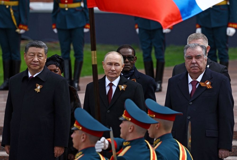 Putin welcomes Xi and Lula at lavish Victory Day parade as Ukraine denounces event Leaders, including Russian President Vladimir Putin, Chinese President Xi Jinping and Tajik President Emomali Rahmon, watch Russian service members marching past during a flower-laying ceremony at the Tomb of the Unknown Soldier on Victory Day, marking the 80th anniversary of the victory over Nazi Germany in World War Two, in central Moscow May 9, 2025. — Reuters pic
