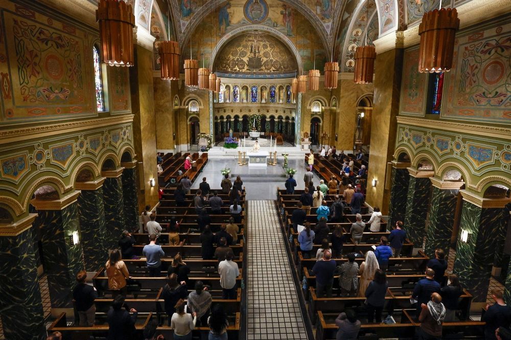 Worshippers gather at the Saint Clement Church for a mass celebration after the naming of US Cardinal Robert Prevost as the new Pope Leo XIV in Chicago, Illinois May 8, 2025. — AFP pic