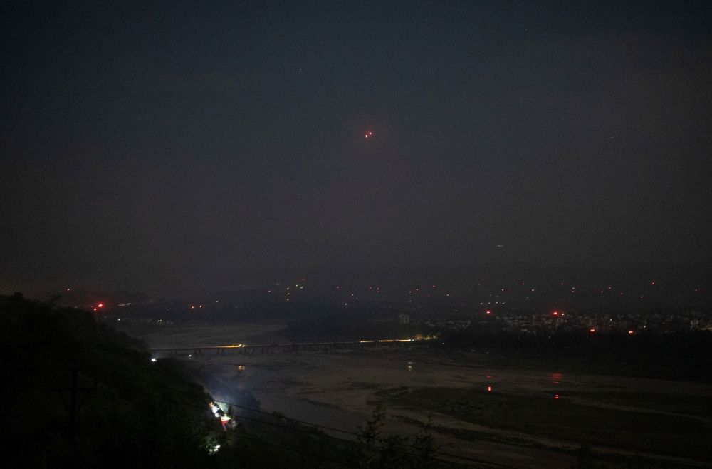 India's air defence system intercepts objects in the sky during a blackout following multiple blasts in the city of Jammu, May 9, 2025. — Reuters pic
