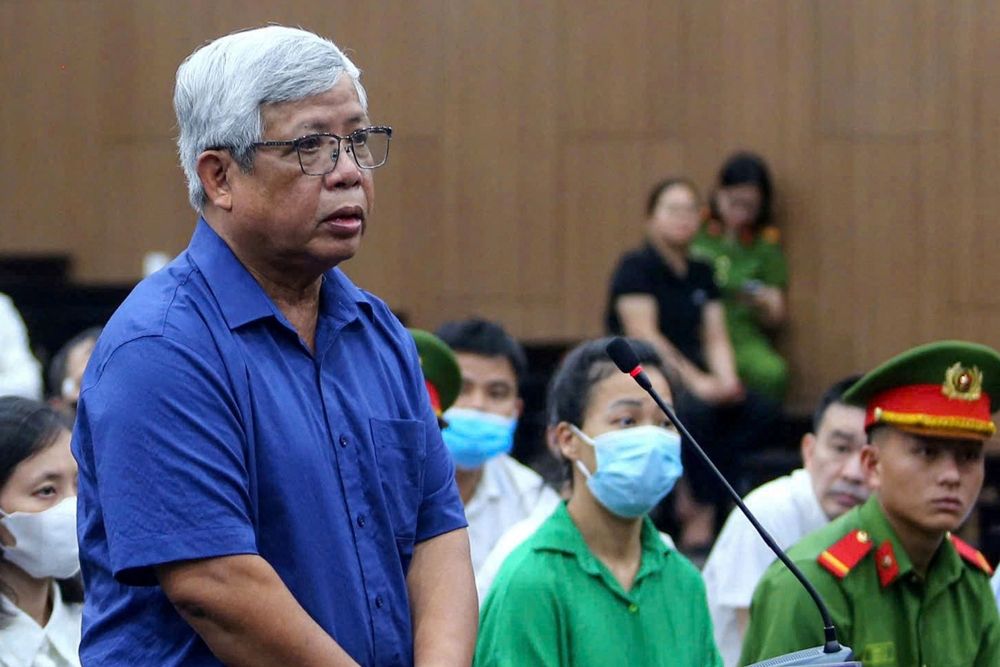 This photo taken on May 12, 2025 shows Vietnam's former deputy minister of natural resources and environment Nguyen Linh Ngoc (L) standing during his trial for illegal exploitation and exports of rare earths at the People's Court in Hanoi. A Vietnamese court on May 21 gave jail terms to 23 officials and business people over the illegal exploitation and export of rare earths. — AFP pic