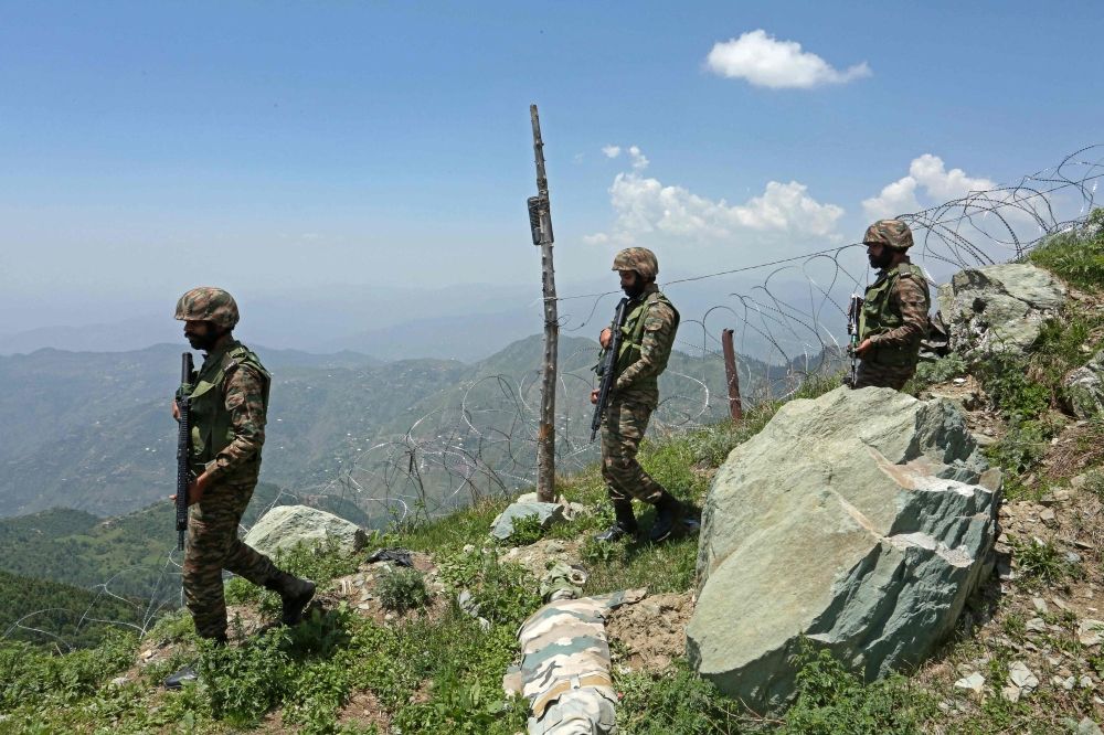 Indian army soldiers patrol along the Line of Control (LoC) between Pakistan and India, in Poonch sector of India's Jammu region May 20, 2025. — AFP pic