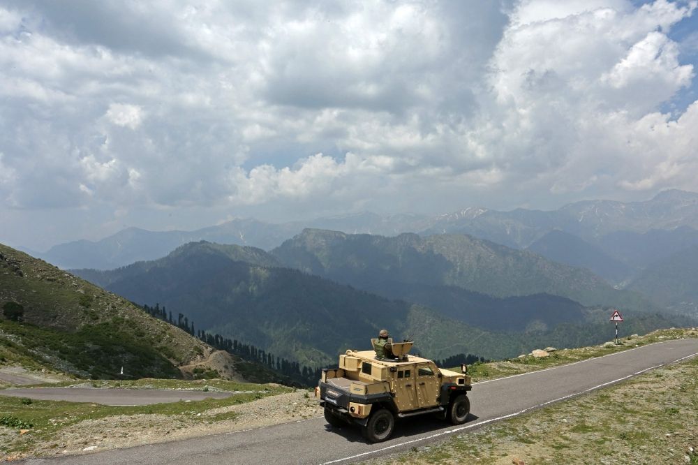 Indian army soldiers patrol in an armoured vehicle near the Line of Control (LoC) between Pakistan and India, in Poonch sector of India's Jammu region May 20, 2025. — AFP pic
