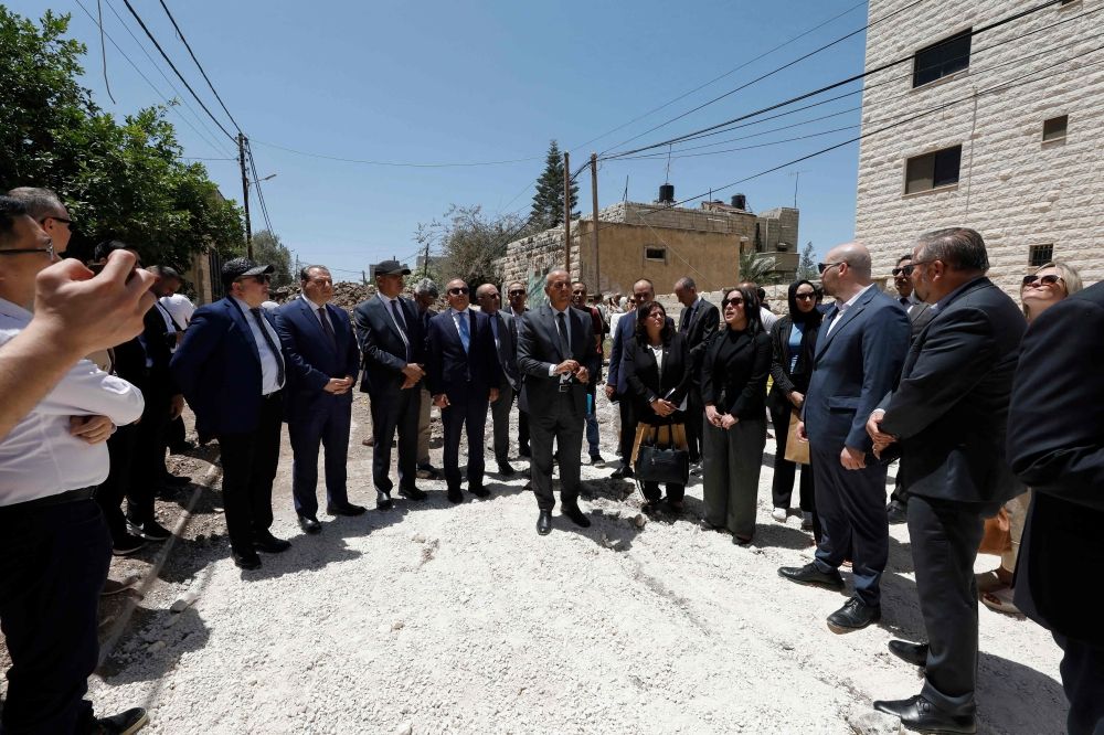 Members of a diplomatic delegation from the European Union gather near the eastern entrance of Jenin camp during a visit to the city of Jenin May 21, 2025. — AFP pic