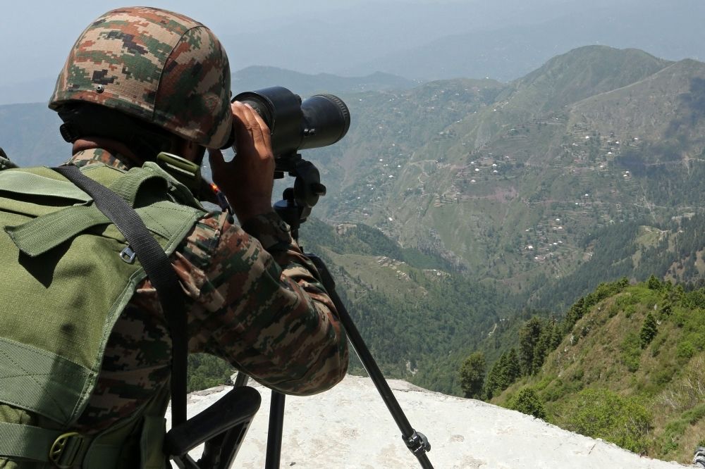 Hooting not shooting: India, Pakistan troops back to uneasy calm after Kashmir clashes An Indian army soldier uses binoculars to keep vigil near the Line of Control (LoC) between Pakistan and India, in Poonch sector of India's Jammu region May 20, 2025. — AFP pic