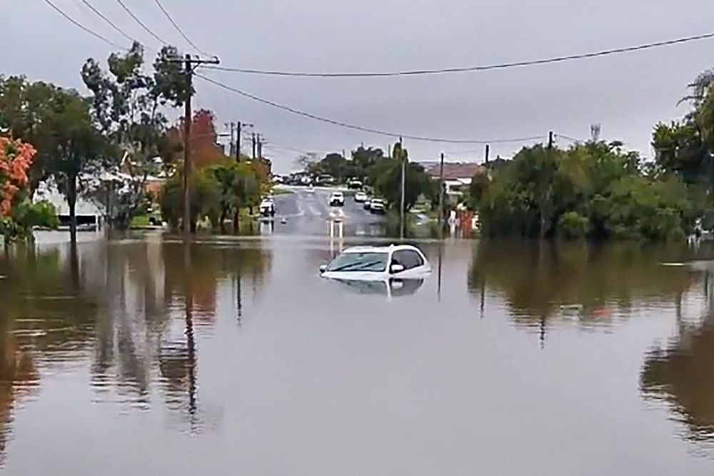 Australia floods: Death toll rises to four, tens of thousands remain stranded This frame grab taken from UGC video handout footage by Instagram account user @Woodshieldposts on May 21, 2025 and released on May 22, 2025 shows a car submerged in a flooded area in the New South Wales town of Taree. — Picture via Instagram/@Woodshieldposts/AFP