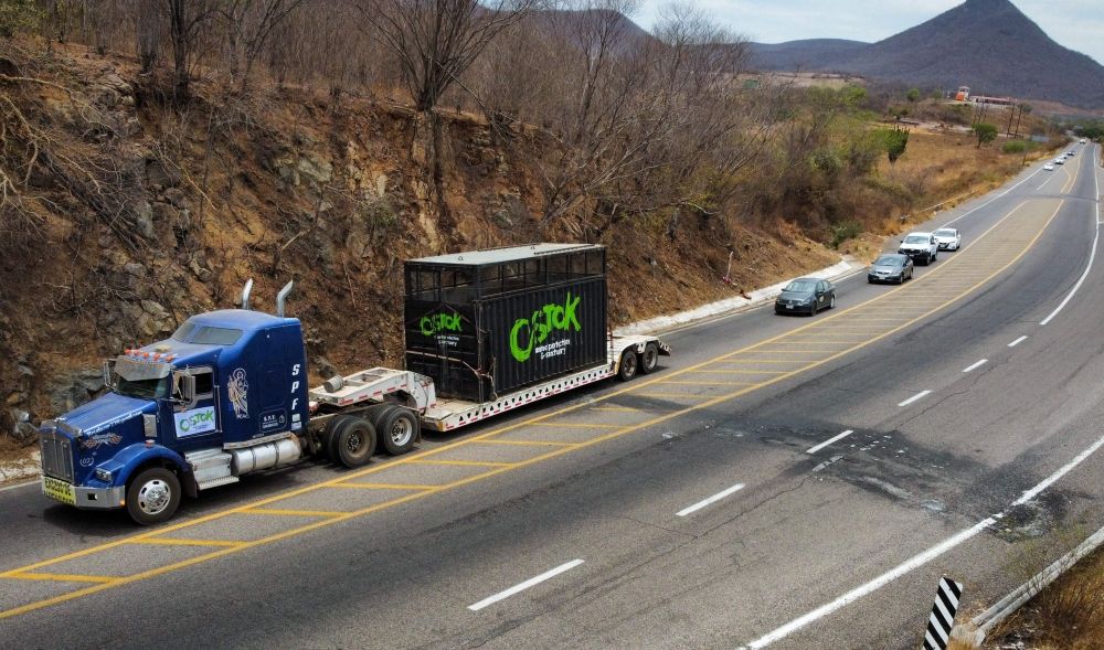 A truck is pictured on the road as it transports an elephant to be relocated to a ranch on the coast from Culiacan, Sinaloa state, Mexico May 20, 2025. — AFP pic