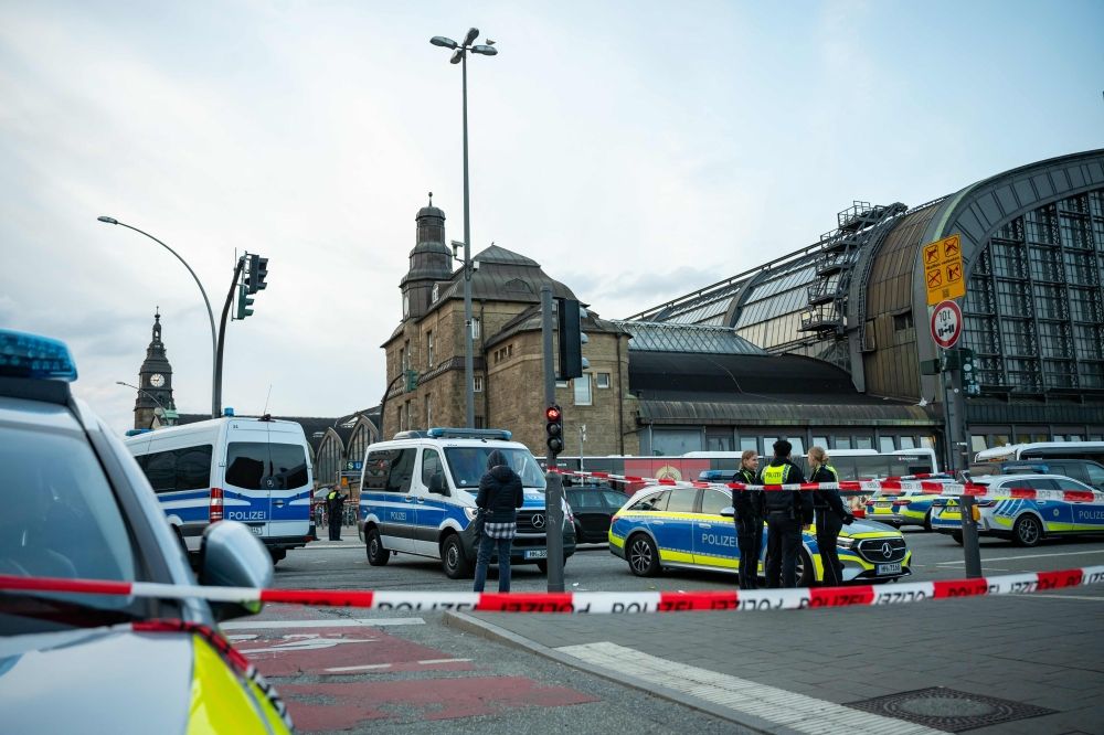 Police work at the scene at Hamburg's main train station where several people have been stabbed May 23, 2025. — AFP pic