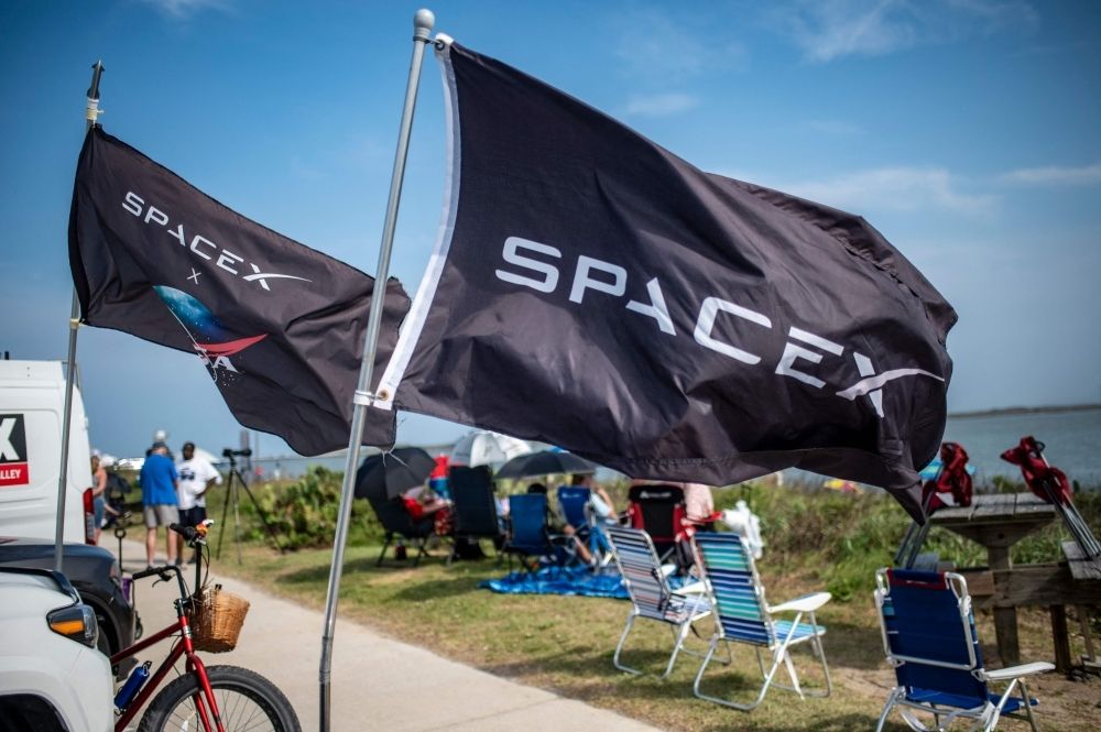 SpaceX Starship explodes over Indian Ocean in third test flight, Musk vows faster launch pace SpaceX flags fly as people wait on South Padre Island to watch the SpaceX Starship rocket launch from Starbase, Texas yesterday. — AFP pic