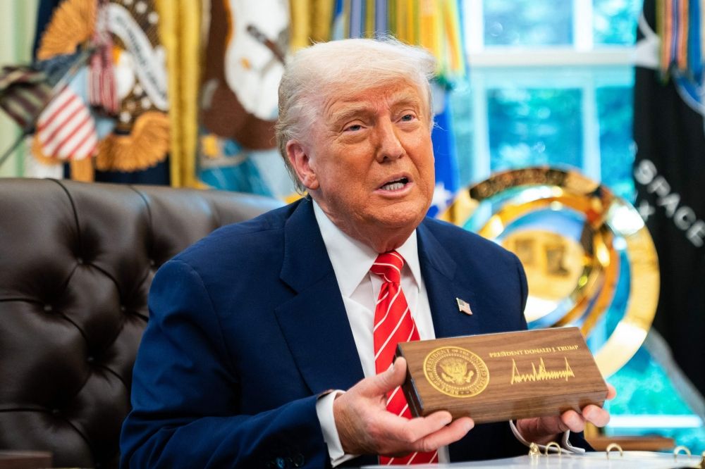 US President Donald Trump speaks during a news conference before presenting Elon Musk with a