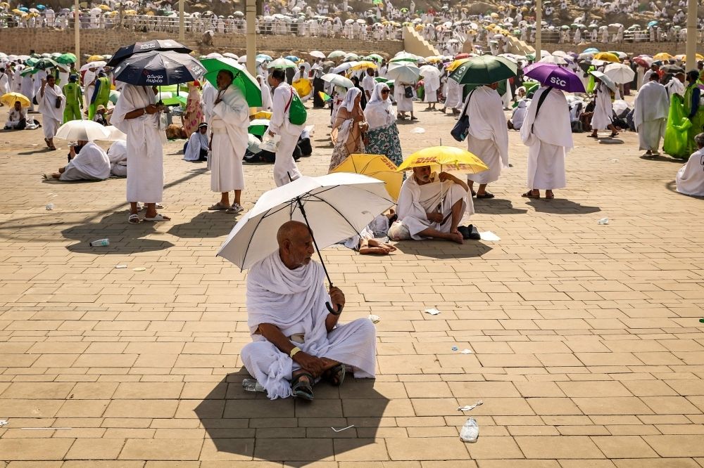 ‘You don’t have to climb Arafat’: Saudi tells pilgrims as Haj heat soars past 40°C Muslim pilgrims use umbrellas to shade themselves from the sun as they arrive at the base of Mount Arafat, also known as Jabal al-Rahma or Mount of Mercy, during the annual hajj pilgrimage on June 15, 2024. — AFP pic