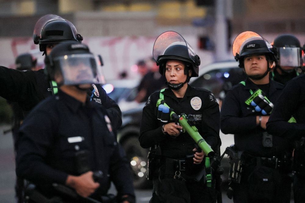 What are the ‘less lethal’ weapons law enforcement is using to control LA protests? Members of law enforcement carry non-lethal weapons, as protests against federal immigration sweeps continue. — Reuters pic