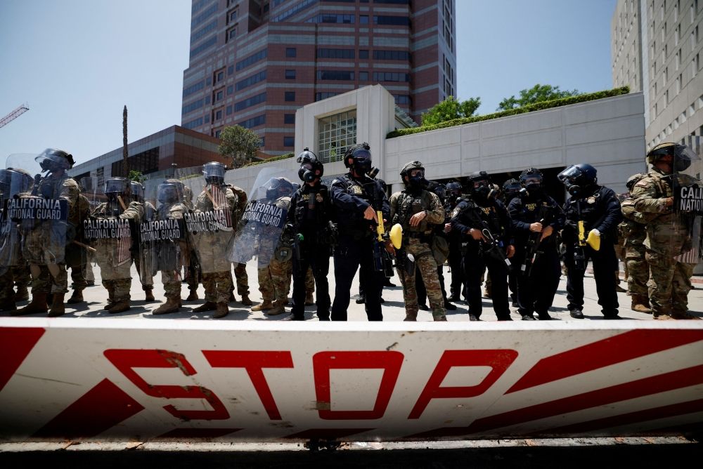 Members of the California National Guard stand guard, as a demonstration against federal immigration sweeps takes place, outside the Edward R. Roybal federal building, after their deployment by U.S. President Donald Trump, in response to protests, in Los Angeles, California June 8, 2025. — Reuters pic