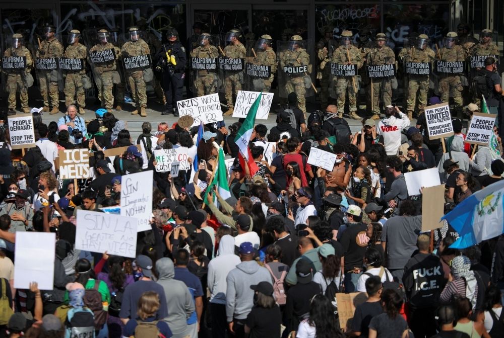 Explained: What role US troops will play in Los Angeles protests and the legal grounds for their deployment Demonstrators gather in front of California National Guard troops, as protests against immigration sweeps continue, in Los Angeles, California June 9, 2025. — Reuters pic