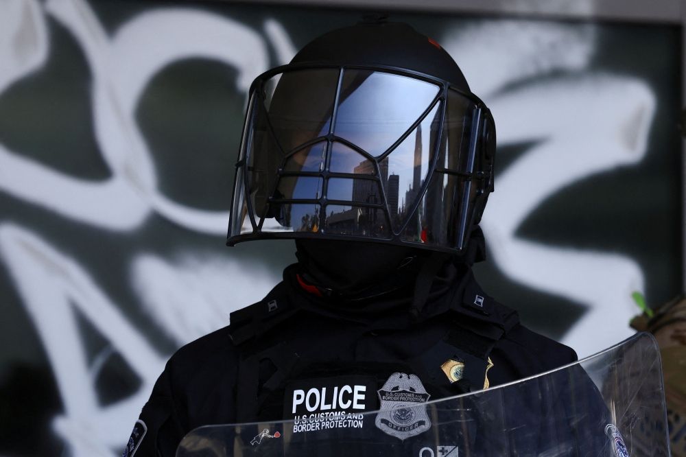 A US Customs and Border Protection officers stands outside the Edward R. Roybal Federal Building, after California National Guard troops were deployed by U.S. President Donald Trump, in response to protests against immigration sweeps, in Los Angeles, California June 9, 2025. — Reuters pic