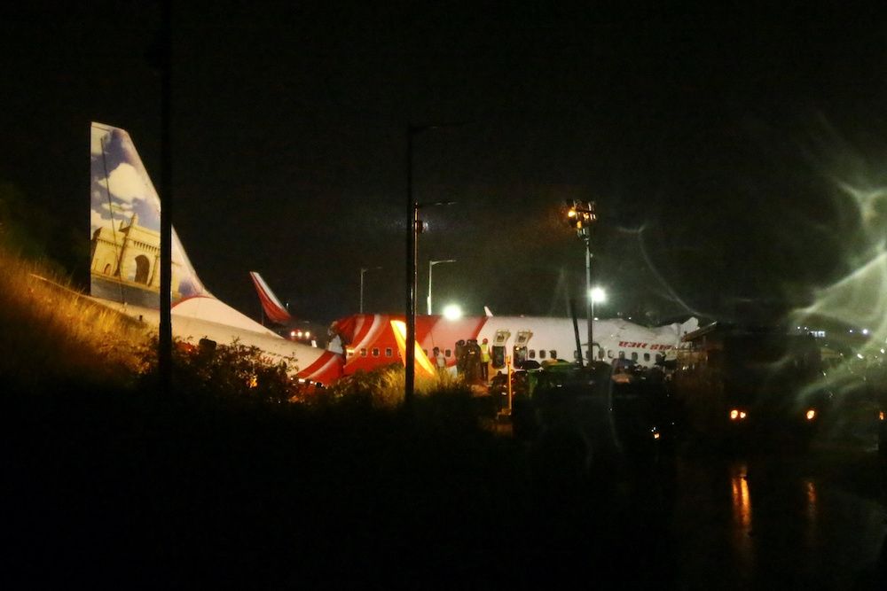 Rescue workers look for survivors after a passenger plane crashed when it overshot the runway at the Calicut International Airport in Karipur, in the southern state of Kerala August 7, 2020. — Reuters pic