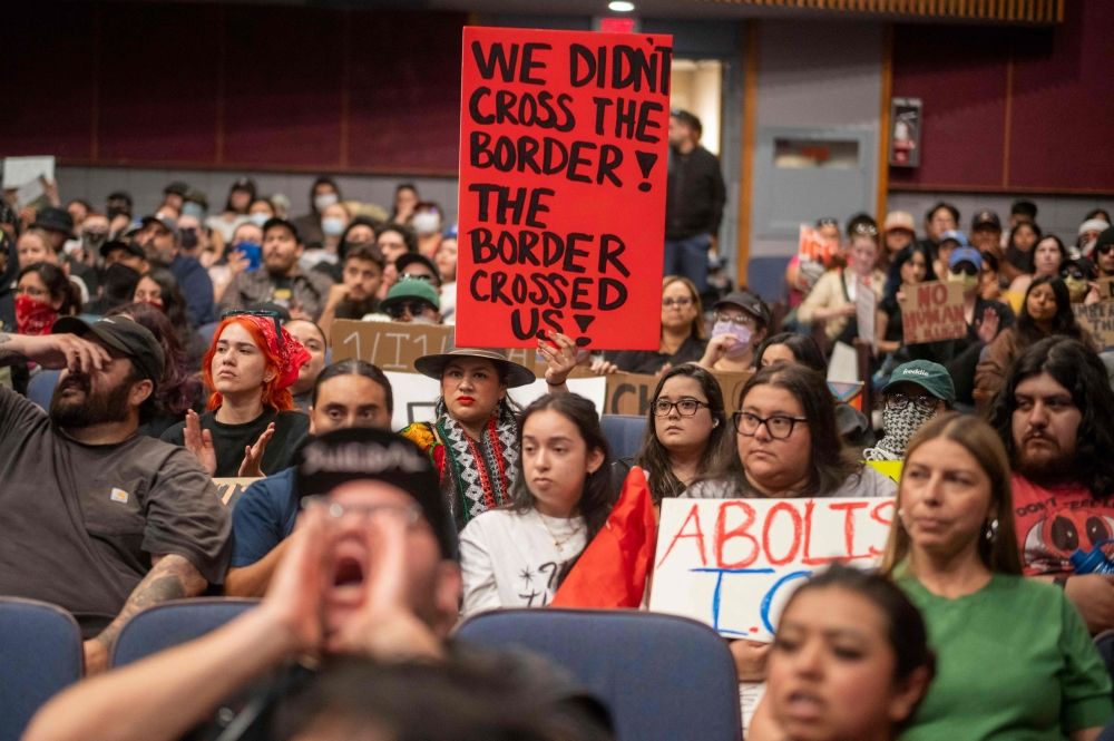 A demonstrator holds a sign during a City Council meeting, demanding Immigration and Customs Enforcement (ICE) to be removed from the community, as demonstrations continue in response to federal immigration operations in the Whittier neighborhood of Los Angeles, California June 10, 2025. — AFP pic
