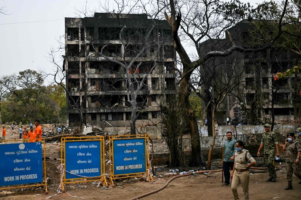 Charred buildings are pictured after Air India flight 171 crashed in a residential area near the airport in Ahmedabad June 13, 2025. — AFP pic