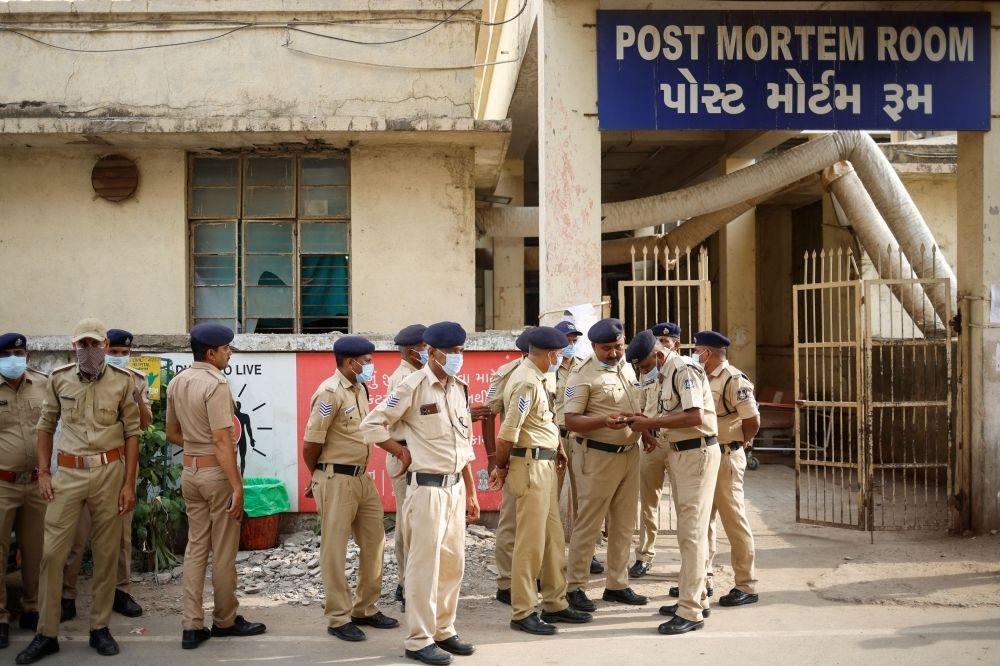 Air India plane crash death toll rises to 279 as search for second black box continues Policemen stand guard outside the post mortem room, where the bodies of the victims who died after the Air India Boeing 787-8 Dreamliner plane bound for London's Gatwick Airport crashed during take-off from Ahmedabad have been kept, at a hospital, in Ahmedabad June 14, 2025. — Reuters pic