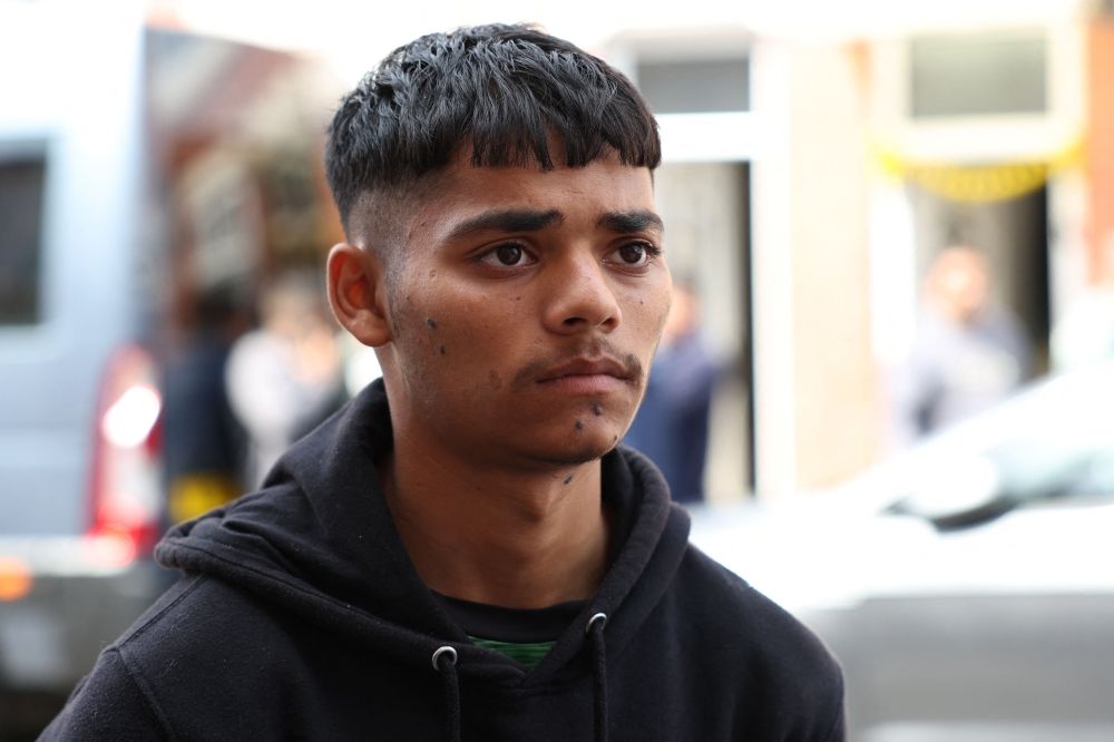 Hiren Kantilal, cousin of Vishwash Kumar Ramesh, gives an interview to an AFP journalist in the street outside the family home of Vishwash, the sole survivor of an Air India crash in Ahmedabad City in India, in Leicester June 13, 2025. — AFP pic