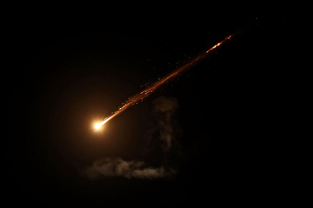 This picture shows a trail from an Iranian rocket in the sky above Jerusalem on June 13, 2025. — AFP pic