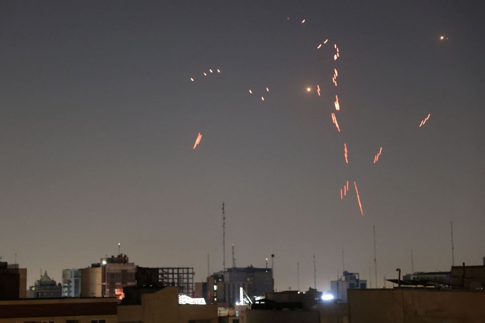 Army air defence firing is seen following the Israeli strike in Tehran, Iran, June 14, 2025. — Majid Asgaripour/WANA (West Asia News Agency)/Reuters pic