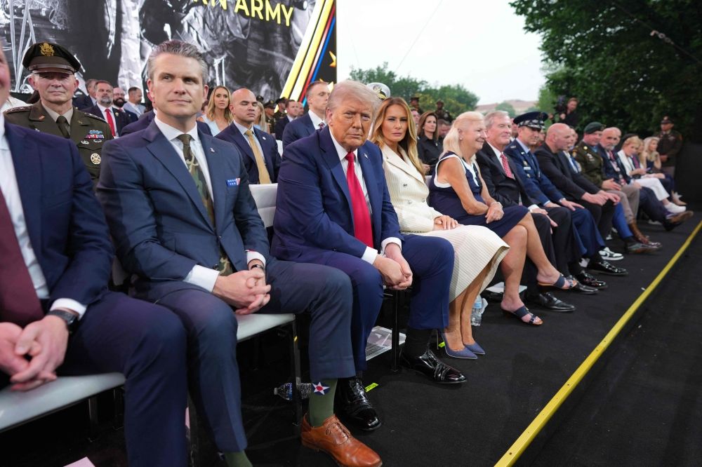 (From left) US Secretary of Defense Pete Hegseth, US President Donald Trump and First Lady Melania Trump attend the Army 250th Anniversary Parade in Washington, DC June 14, 2025. — Doug Mills/Pool/AFP pic