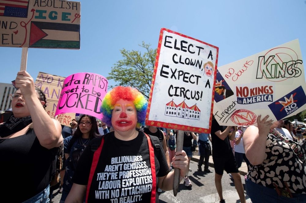 ‘No crown for the clown’: Tens of thousands throng US streets against ‘king’ Trump in nationwide rallies People take part in a ‘No Kings’ protest in Denver, Colorado, on June 14, 2025 as US President Donald Trump presides over a military parade in Washington, DC. — AFP pic