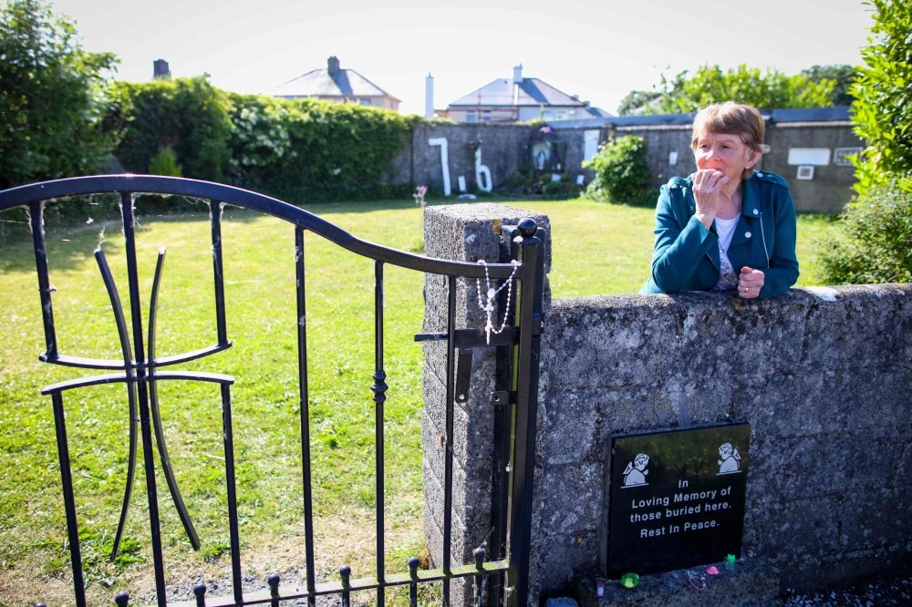 Historian Catherine Corless poses on the site of the former St Mary's Mother and Baby Home, in Tuam, in the outskirts of Galway, western Ireland, a site believed to be containing a mass grave of children and mothers, on May 20, 2025. — AFP pic