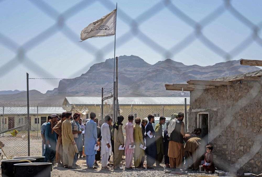Afghan refugees wait in a queue at a registration centre, after arriving from Pakistan, in Takhta Pul district of Kandahar province on April 13, 2025. It’s hard to say how many Afghans have returned to Pakistan, as data is scarce. — AFP pic