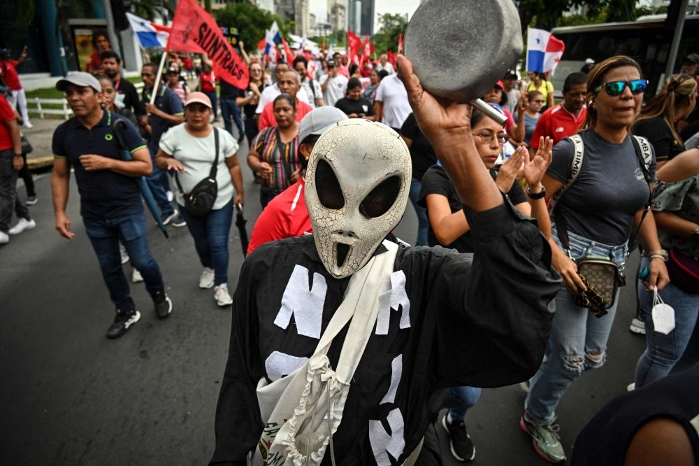 ‘Vandals took over the airport’: State of emergency declared in Panama as protests escalate A person wearing an alien mask attends a rally against the government of Panama's President Jose Raul Mulino in Panama City June 20, 2025. — AFP
