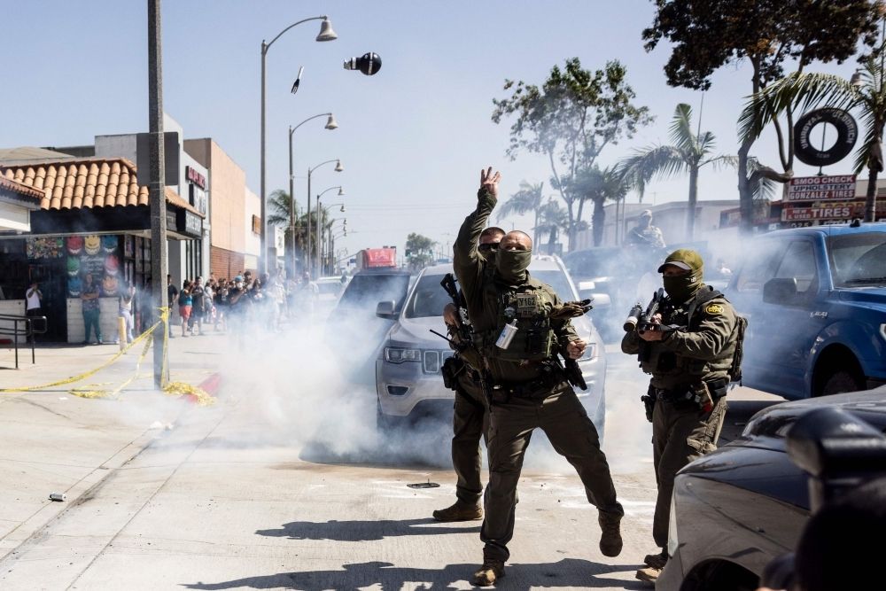 US immigration crackdown: Are masked ICE agents creating a ‘secret police’ in America? A US Customs and Border Protection (CBP) officer throws a Stinger CS rubber ball grenade at community members pushing back against a raid attempt on a store in Bell, just south of Los Angeles, California, June 20, 2025. — AFP pic