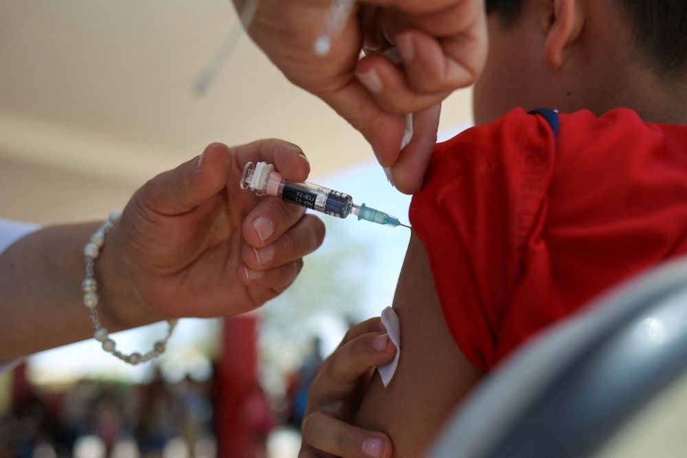 Study warns of deadly fallout as childhood vaccine rates drop, millions at risk as measles and polio resurge A health worker administers a dose of the measles vaccine to a child during a measles vaccination drive in Ciudad Juarez, Mexico, June 15, 2025. — Reuters pic