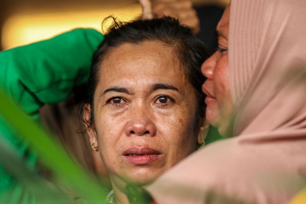 Search resumes for 30 missing as ferry to Bali capsizes in bad weather killing six including child Family members and relatives wait for updates on the search operation of at least 61 people who were missing after a ferry sank off the popular Indonesian resort island of Bali, at Ketapang Port in Banyuwangi, East Java yesterday. — AFP pic