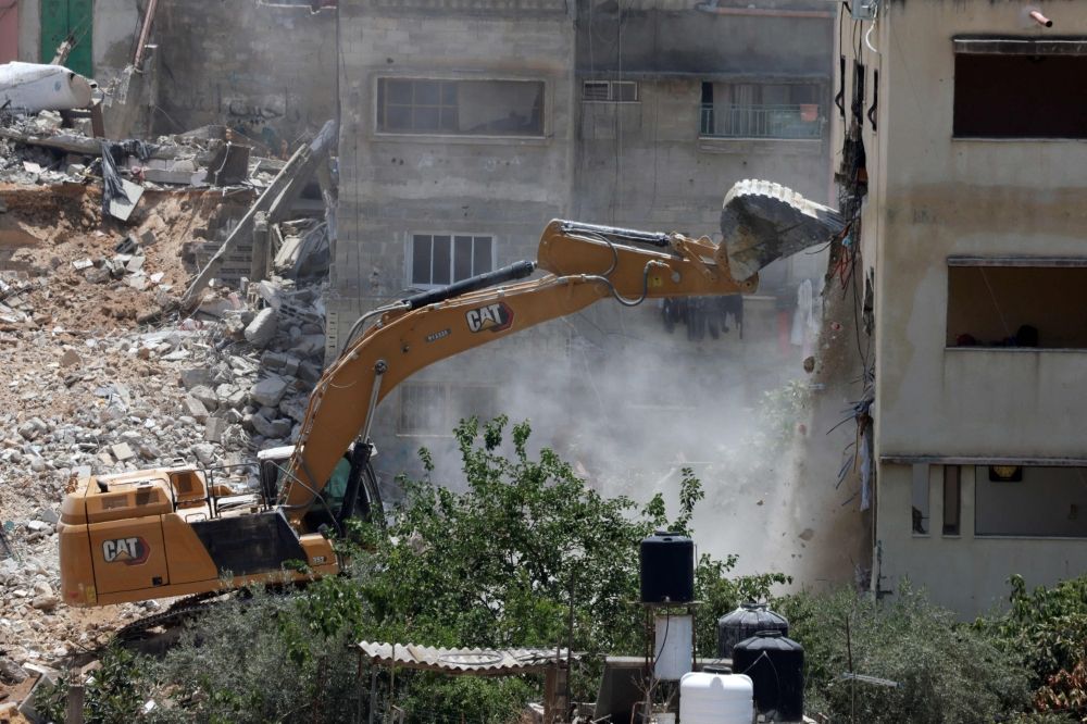 An Israeli military bulldozer demolishes a home at the Nur Shams Palestinian refugee camp, east of Tulkarem, in the Israeli occupied West Bank June 23, 2025, during an ongoing military operation in the north of the Palestinian West Bank. — AFP pic