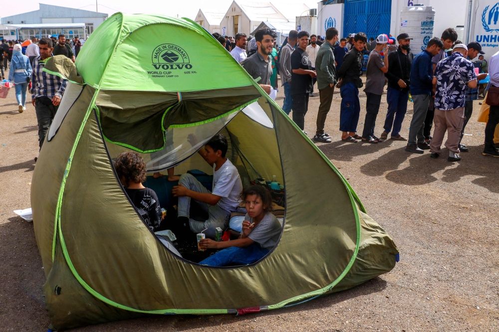 Afghan refugees arrive from Iran at Islam Qala border between Afghanistan and Iran, on July 5, 2025. — AFP pic