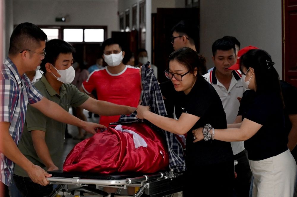 Relatives move the body of a victim after a tourist boat capsized in Ha Long Bay, at a funeral home in Ha Long, Quang Ninh province on July 20, 2025. — AFP pic Relatives move the body of a victim after a tourist boat capsized in Ha Long Bay, at a funeral home in Ha Long, Quang Ninh province on July 20, 2025. — AFP pic