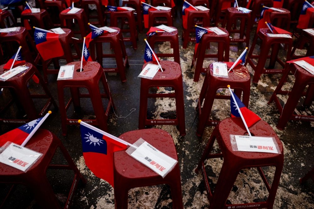 Signs against the recall movement and Taiwanese flags are kept on stools, as people gather in Taoyuan July 20, 2025. — Reuters pic Signs against the recall movement and Taiwanese flags are kept on stools, as people gather in Taoyuan July 20, 2025. — Reuters pic