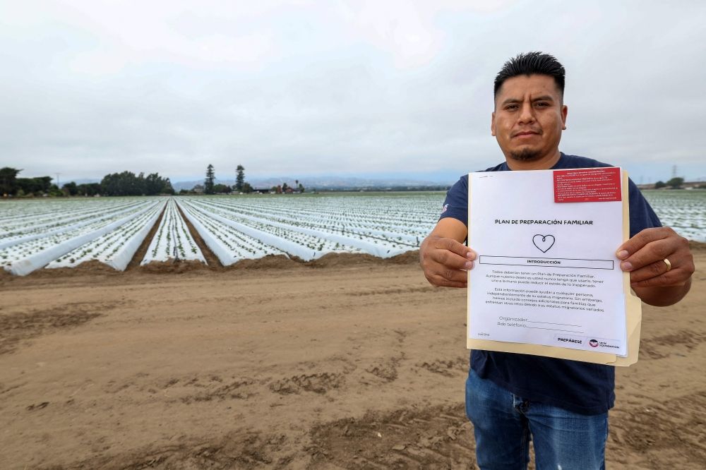 Francisco Panfilo holds a ‘plan de preparacion familiar’ (family preparedness plan) in front of a strawberry field, in Oxnard, California, July 14, 2025. — AFP pic Francisco Panfilo holds a ‘plan de preparacion familiar’ (family preparedness plan) in front of a strawberry field, in Oxnard, California, July 14, 2025. — AFP pic