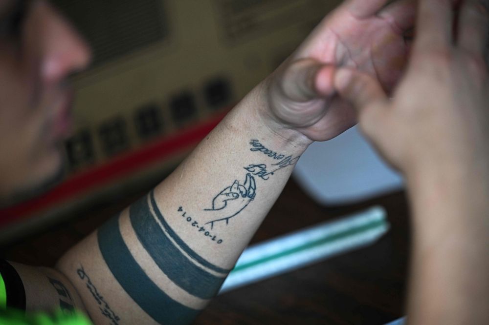 A tattoo on the arm of Mervin Yamarte, a Venezuelan migrant repatriated from a prison in El Salvador, is pictured during an interview with AFP at Los Pescadores neighbourhood in Maracaibo, Venezuela, July 23, 2025. — AFP pic A tattoo on the arm of Mervin Yamarte, a Venezuelan migrant repatriated from a prison in El Salvador, is pictured during an interview with AFP at Los Pescadores neighbourhood in Maracaibo, Venezuela, July 23, 2025. — AFP pic