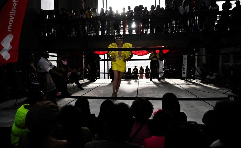 Venezuelan designers turn used garments into avant-garde fashion statements in national competition Ninety fashion aficionados showcased lace, denim, cotton, satin and recycled garments in an eclectic ‘battle of outfits’ on Saturday at Venezuela’s National Art Gallery in Caracas, challenging conventional fashion and embracing their ‘unusual’ identities. — AFP pic