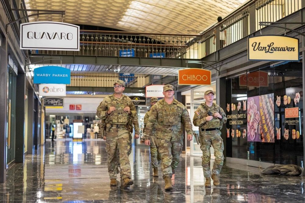 From Washington to Baltimore, Trump’s troop threats ignite fierce backlash National Guard members patrol Union Station in Washington, DC on August 24, 2025, after President Donald Trump ordered federal officers to assist in crime prevention. — AFP pic