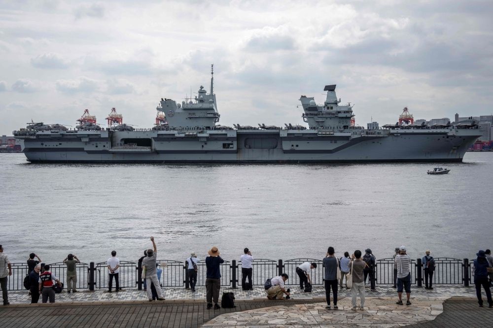 Japan hails ‘unprecedented’ security ties as British aircraft carrier visits Tokyo People take photographs of British aircraft carrier HMS Prince of Wales arriving at Tokyo Bay August 28, 2025. — AFP pic