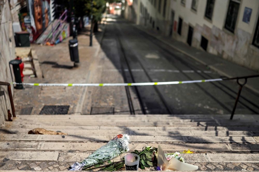 Lisbon funicular cable disconnected before crash that killed 16, inspectors say Flowers and tributes are pictured up the stairs at the site of the Gloria funicular accident after the wreckage was removed in Lisbon on September 5, 2025. — AFP pic
